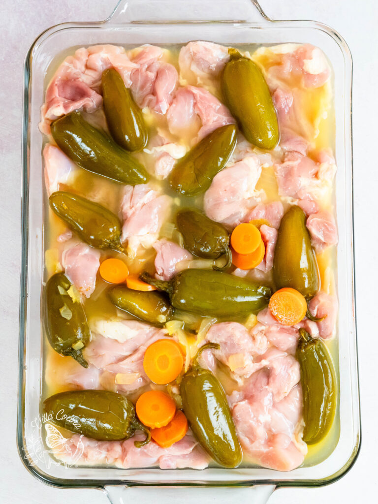 Chicken marinating in a jalapeño brine juice